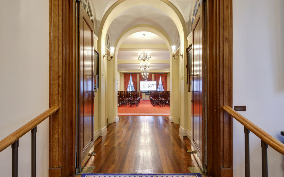 Photography of venue space in Gray's Inn. Stairs lead up to a doorway and into a large conference room