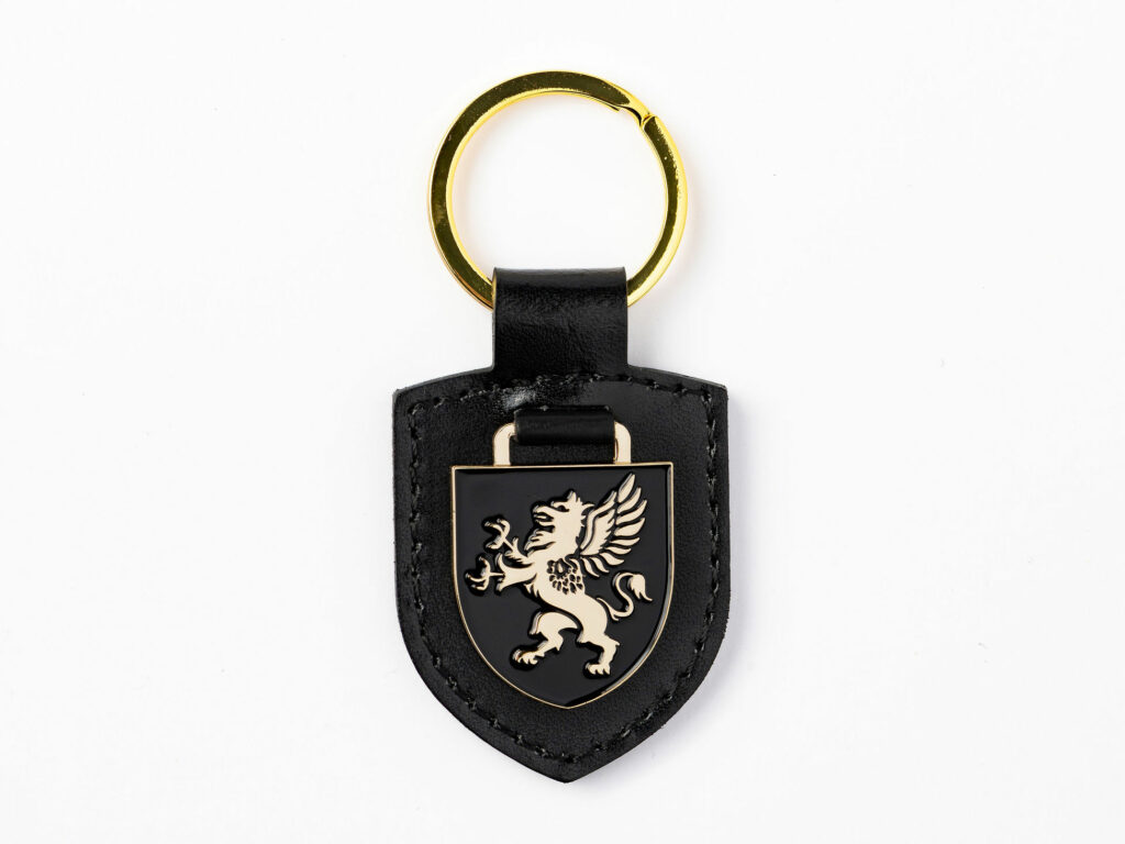 Shield keyring in black faux leather with gold enamel griffin