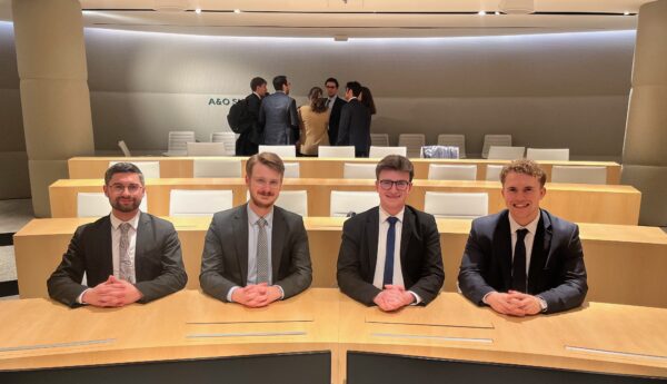 Team photo of four male Vis Moot members