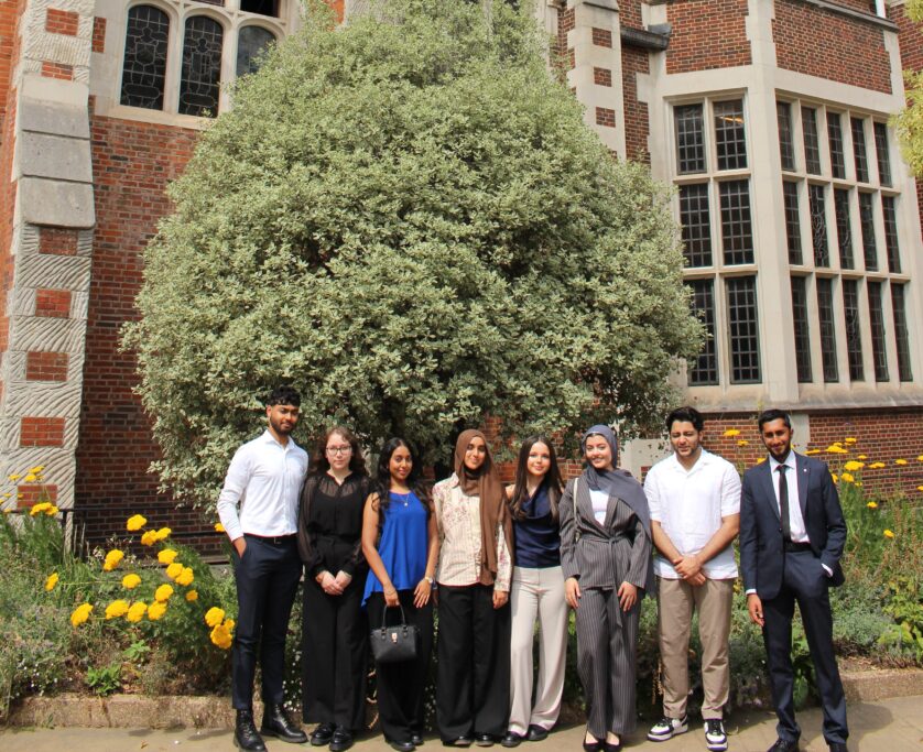 Group photo of City of London undergraduate scholars standing outside infront of the tree by the benchers' entrance